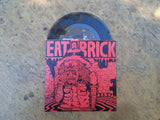 Eat A Brick 7" Demo on black vinyl with red cover